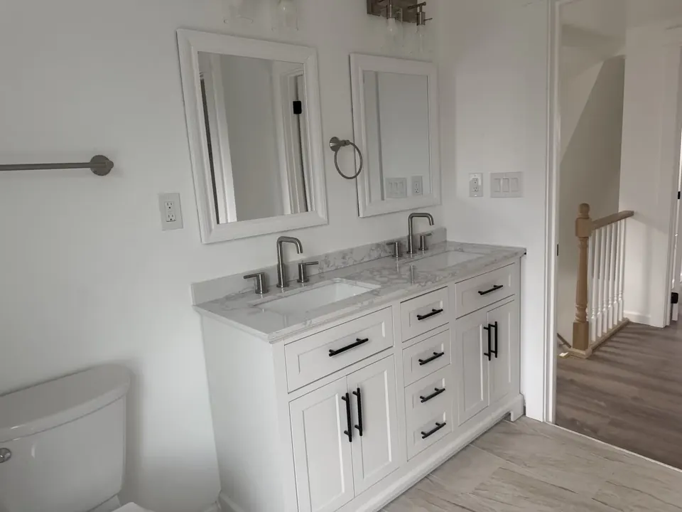 Bathroom and tile renovations: Bathroom renovation progress, tile installation, and finished fixtures.