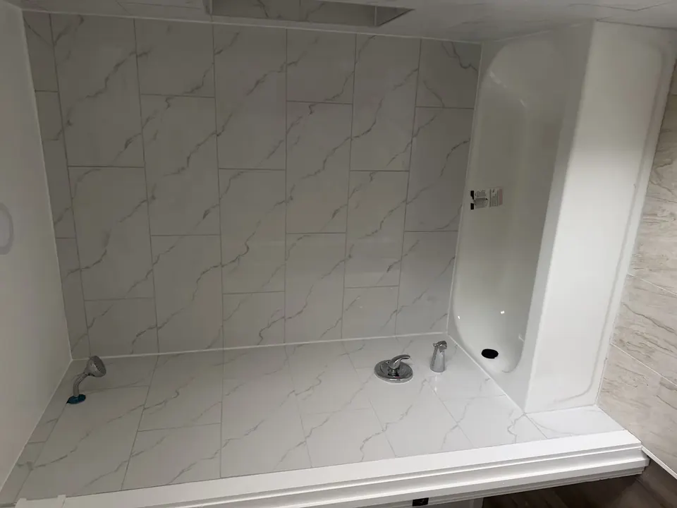 Bathroom and tile renovations: Bathroom renovation progress, tile installation, and finished fixtures.