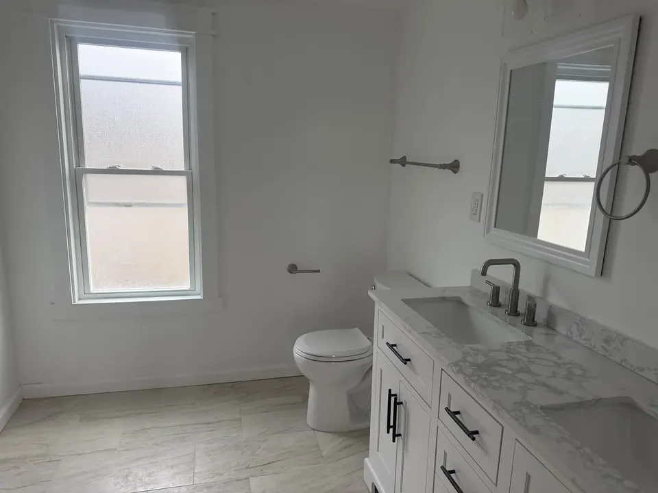 Bathroom and tile renovations: Bathroom renovation progress, tile installation, and finished fixtures.