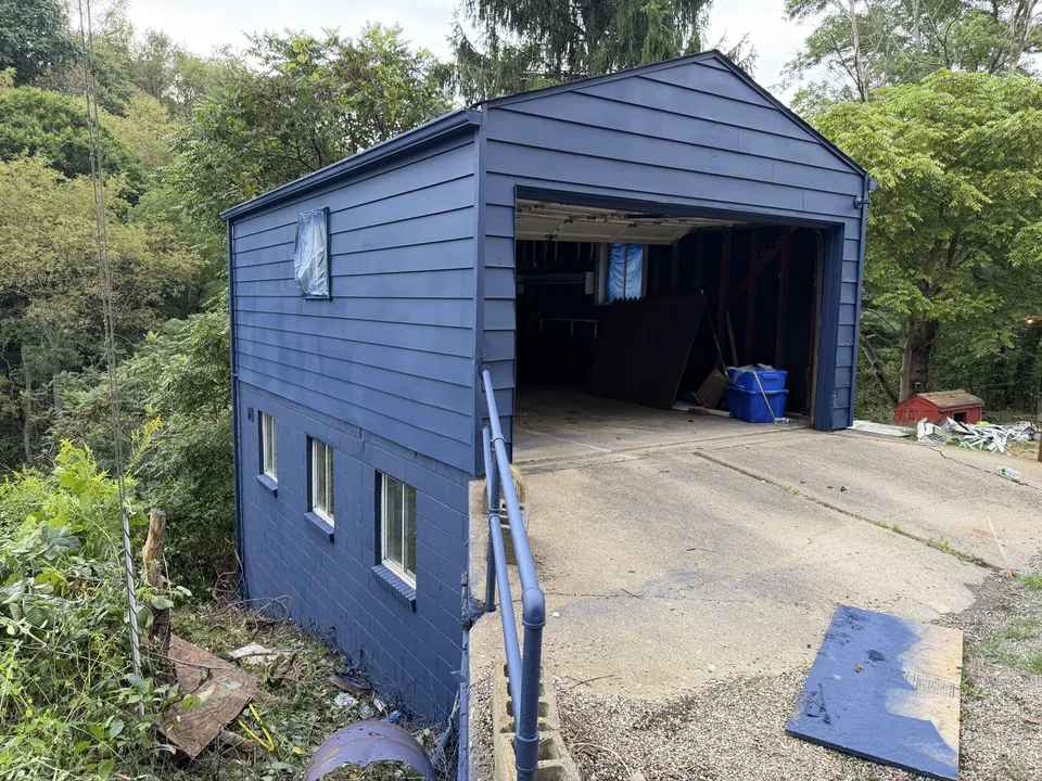 Detached garage with blue siding